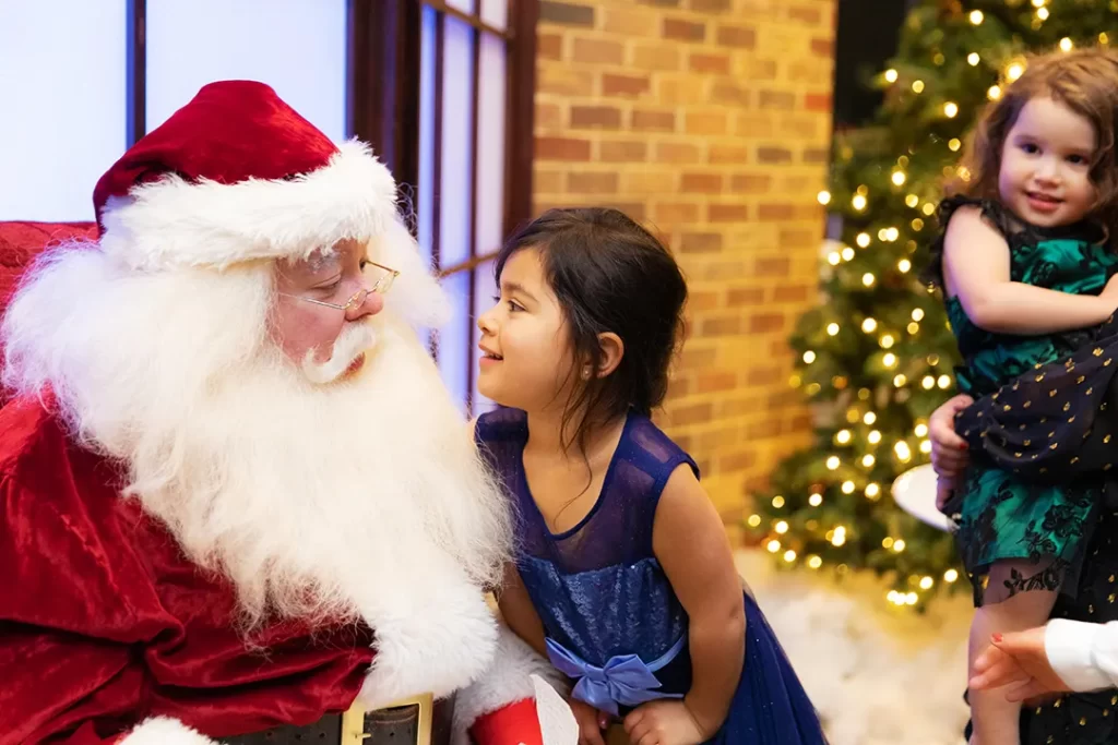 Santa talking to a little girl