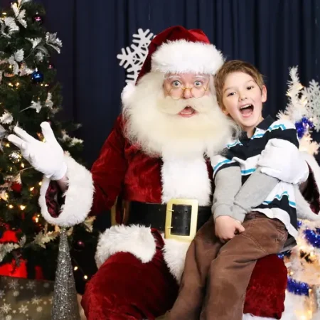 Santa with a boy seating on his lap