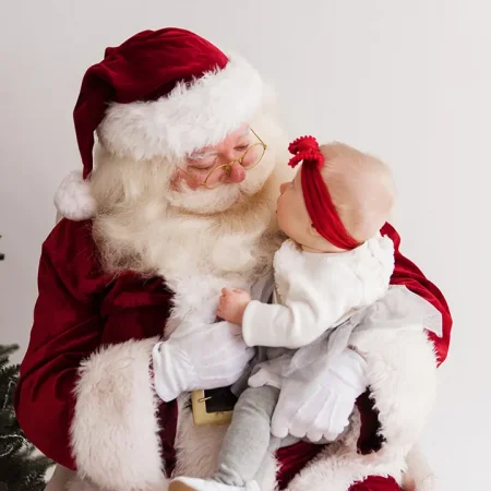 Santa with a baby staring at him