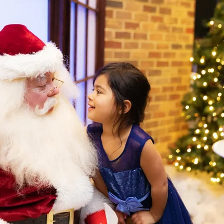 Santa talking to a little girl